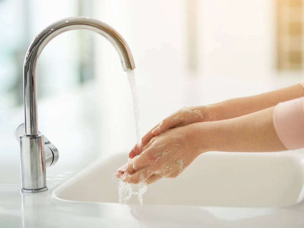Person experiencing compulsive cleaning behaviours associated with OCD